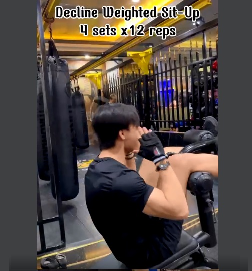 Decline weighted sit ups